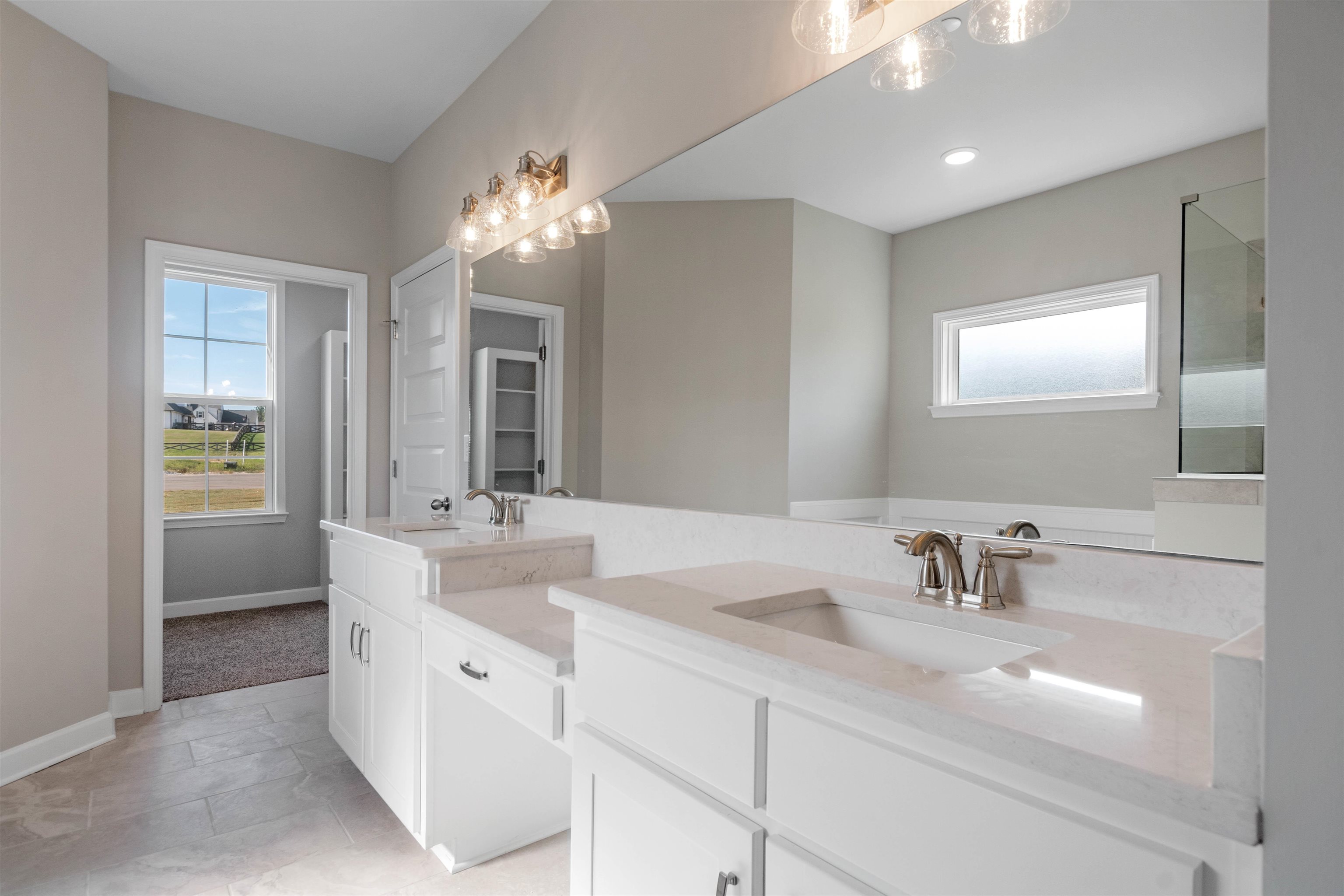 20 Grassy Hill Road Collierville, TN 38017 - Photo 14 of 27 a bathroom with a sink double vanity and a mirror