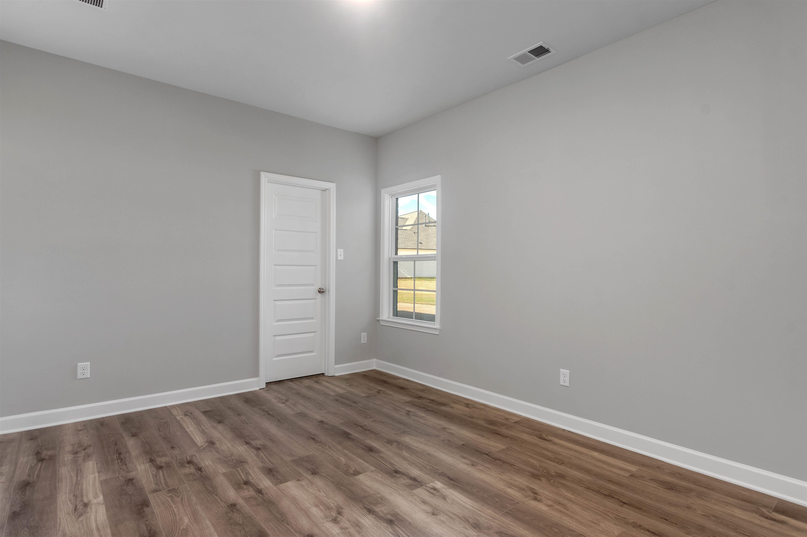 20 Grassy Hill Road Collierville, TN 38017 - Photo 17 of 27 a view of empty room with wooden floor and fan