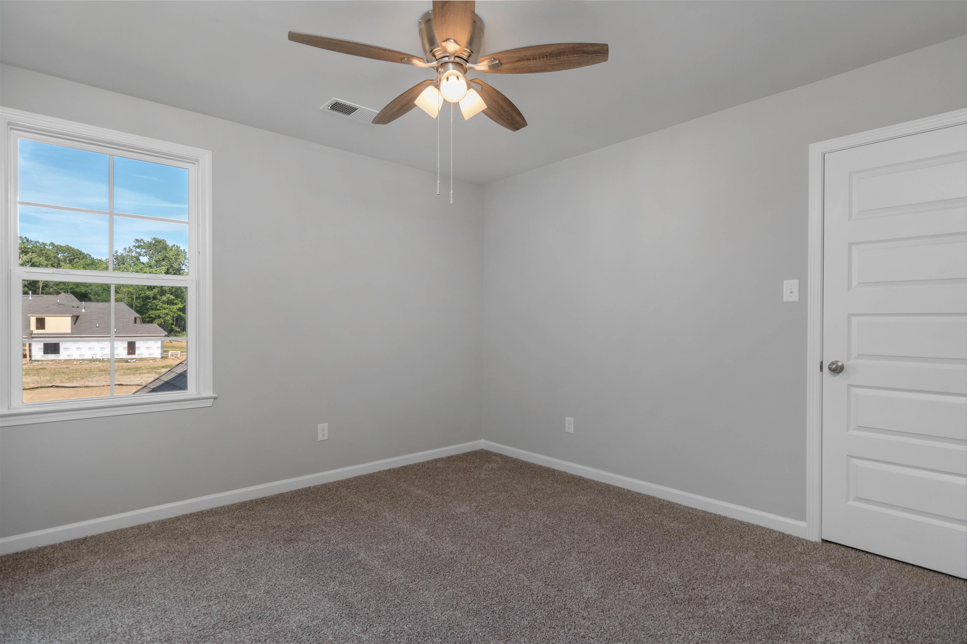20 Grassy Hill Road Collierville, TN 38017 - Photo 19 of 27 an empty room with a window and a fan