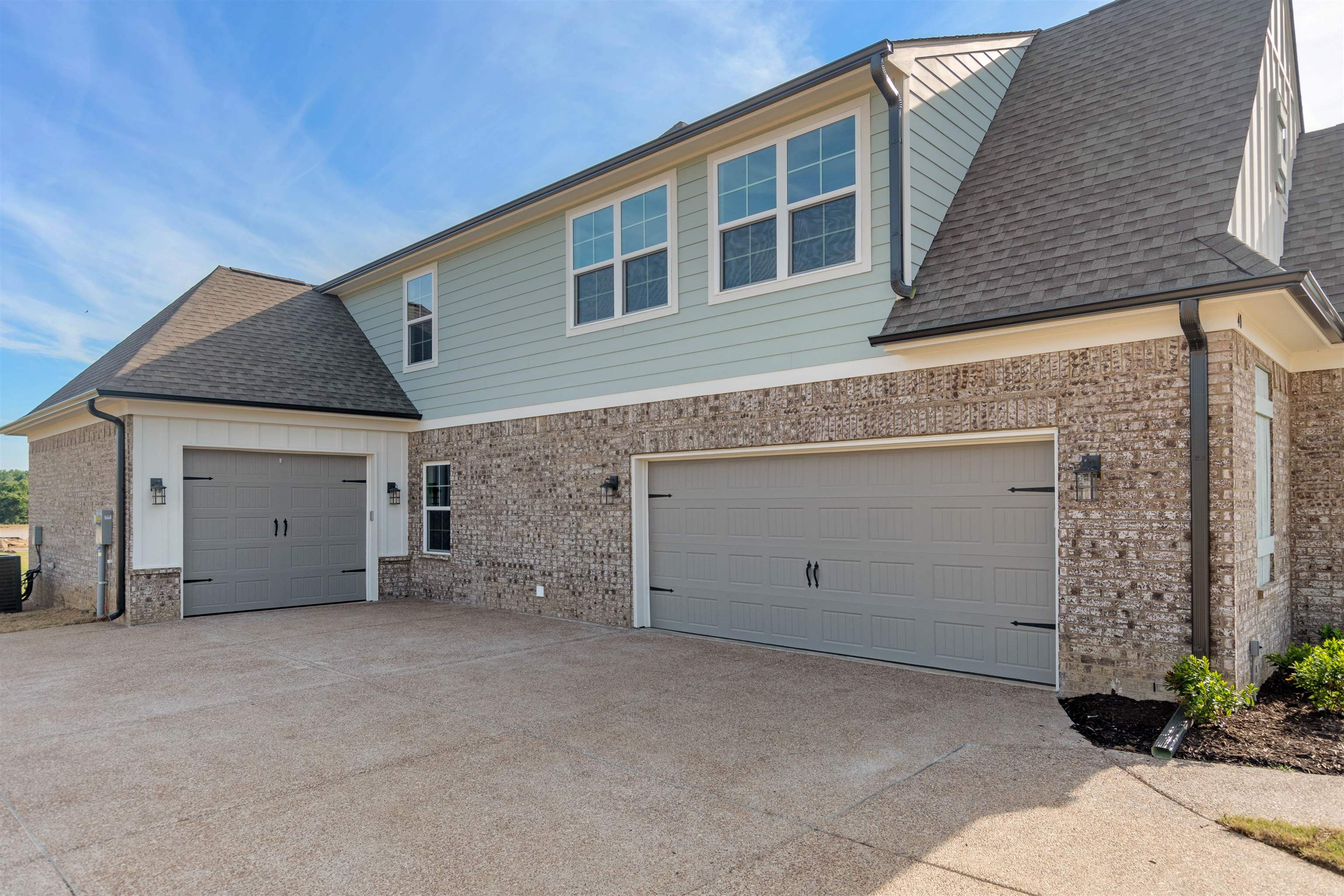 20 Grassy Hill Road Collierville, TN 38017 - Photo 26 of 27 a view of an house with backyard and garage