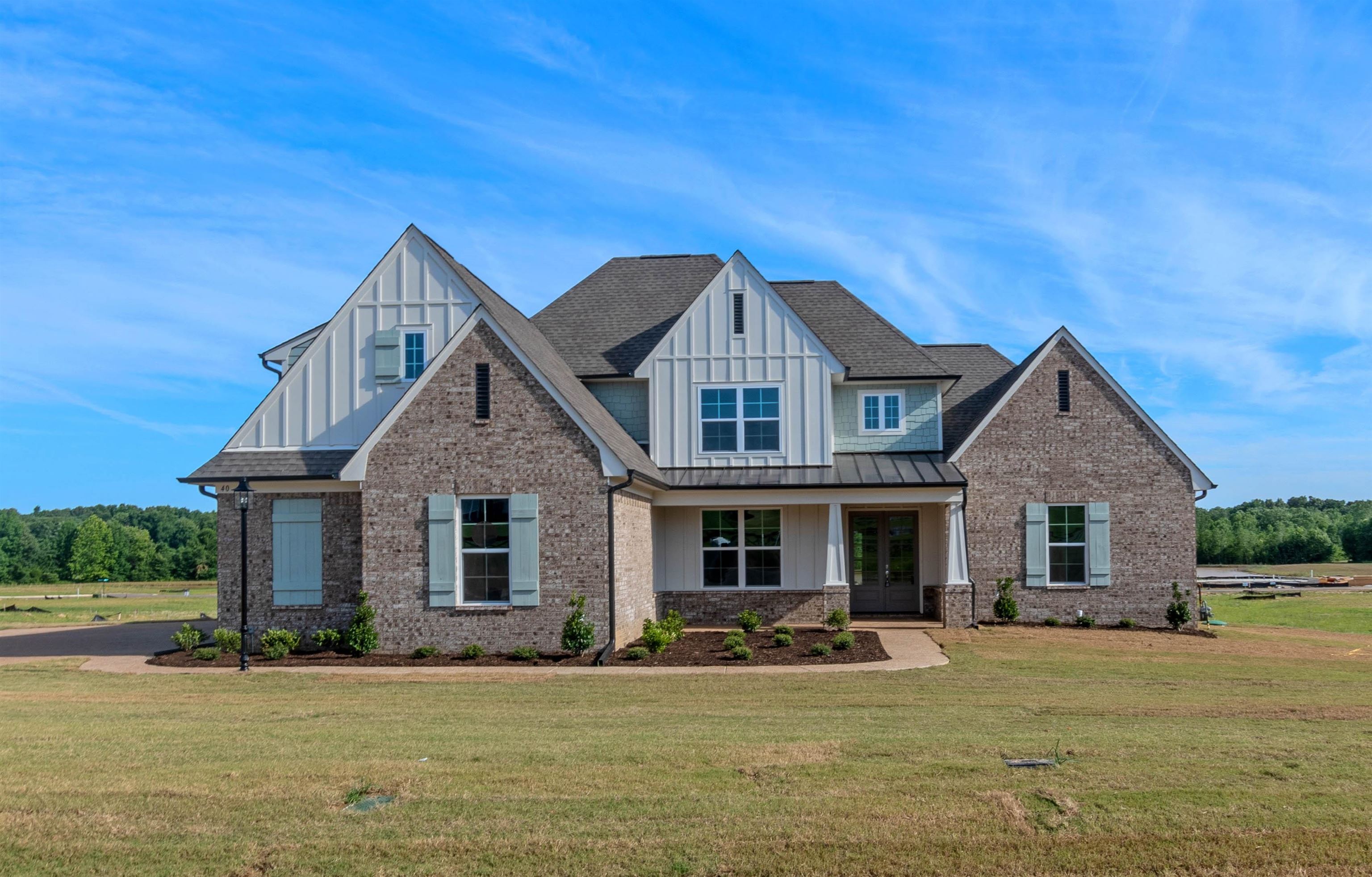 20 Grassy Hill Road Collierville, TN 38017 - Photo 27 of 27 a front view of a house with swimming pool having outdoor seating