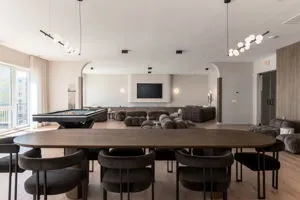 a living room with furniture pool and a flat screen tv