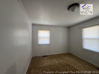338 Summerhill Road Fayetteville, NC 28303 - Photo 16 of 28 an empty room with a window