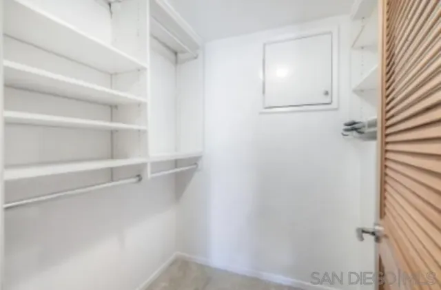 a view of an empty walk in closet