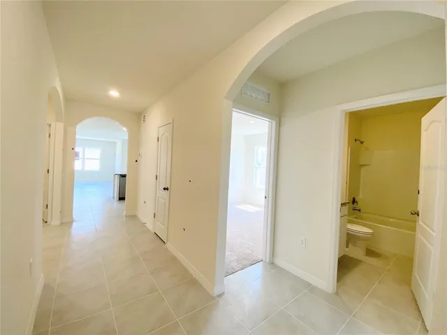 a view of a hallway with a room