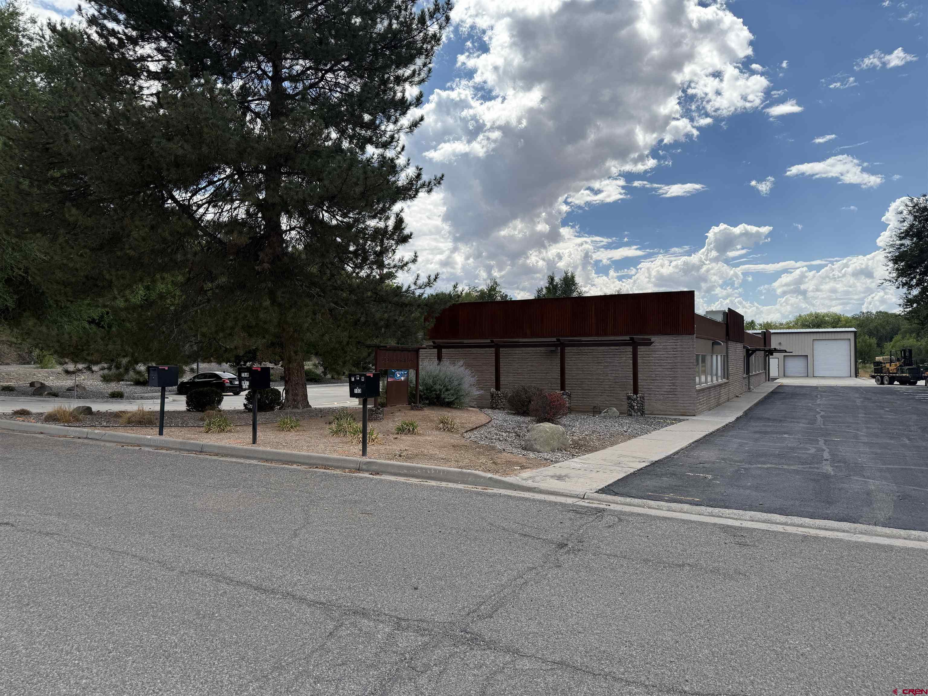 675 Industrial Boulevard, Unit 102 AND WAREHOUSE Delta, CO 81416 - Photo 1 of 24 a backyard of a house with table and chairs