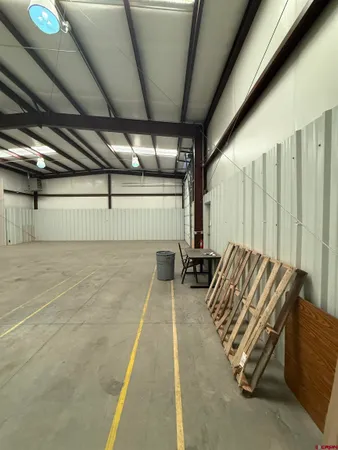 a view of a parking space with furniture