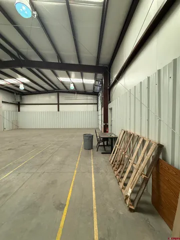 a view of a parking space with furniture