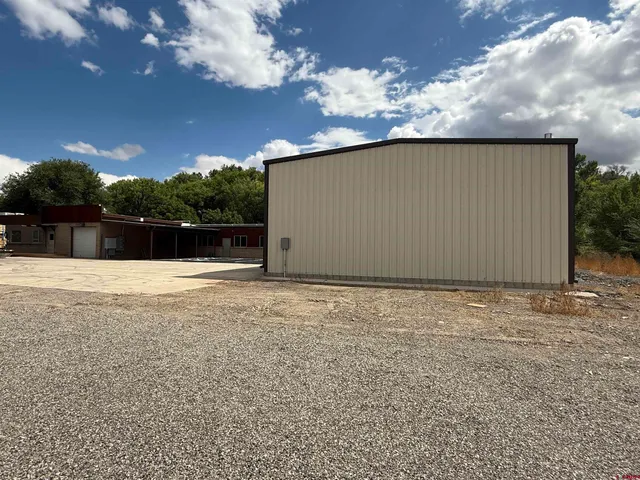 a view of outdoor space with yard and mountain view