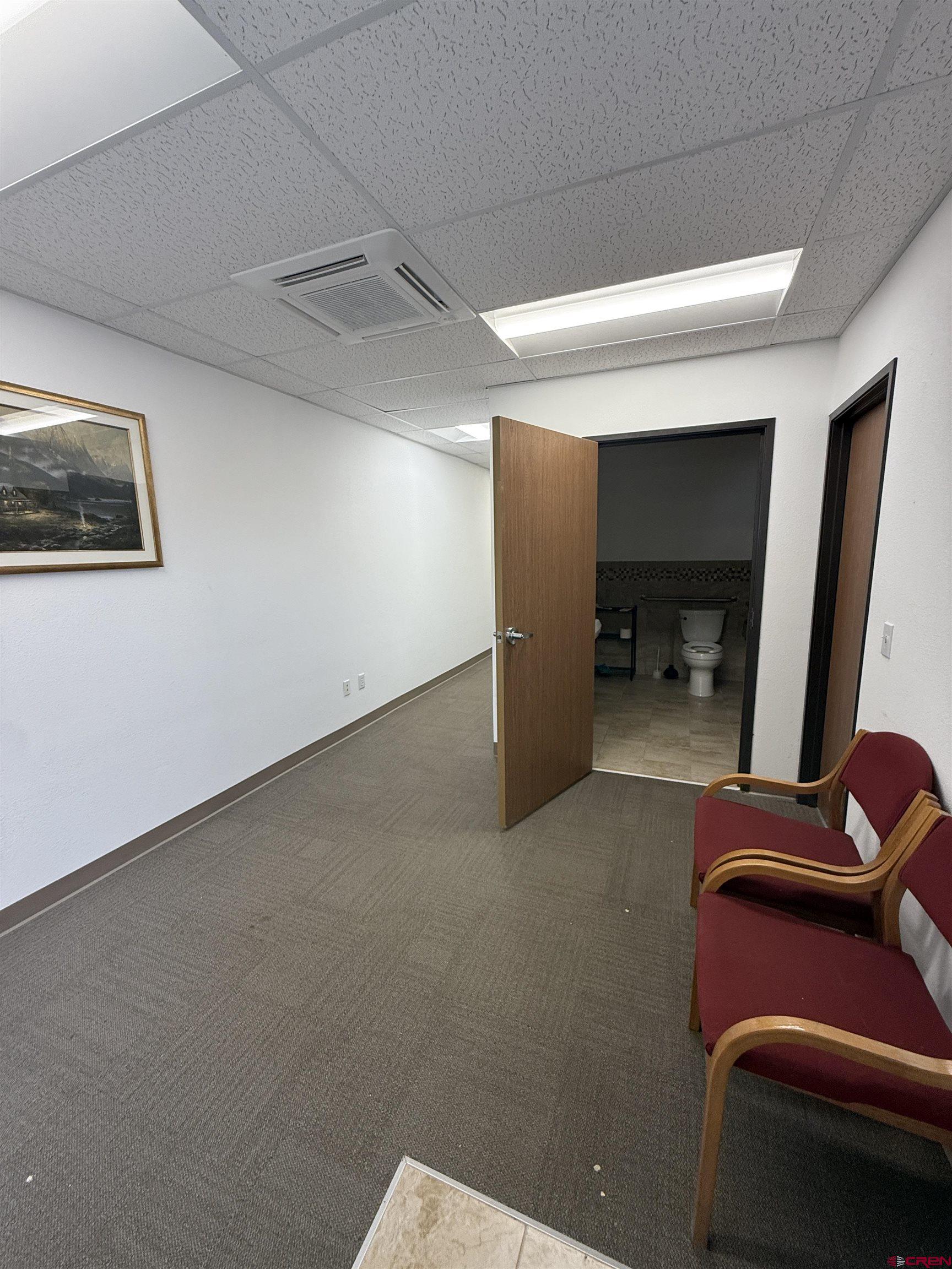 675 Industrial Boulevard, Unit 102 AND WAREHOUSE Delta, CO 81416 - Photo 3 of 24 a living room with furniture