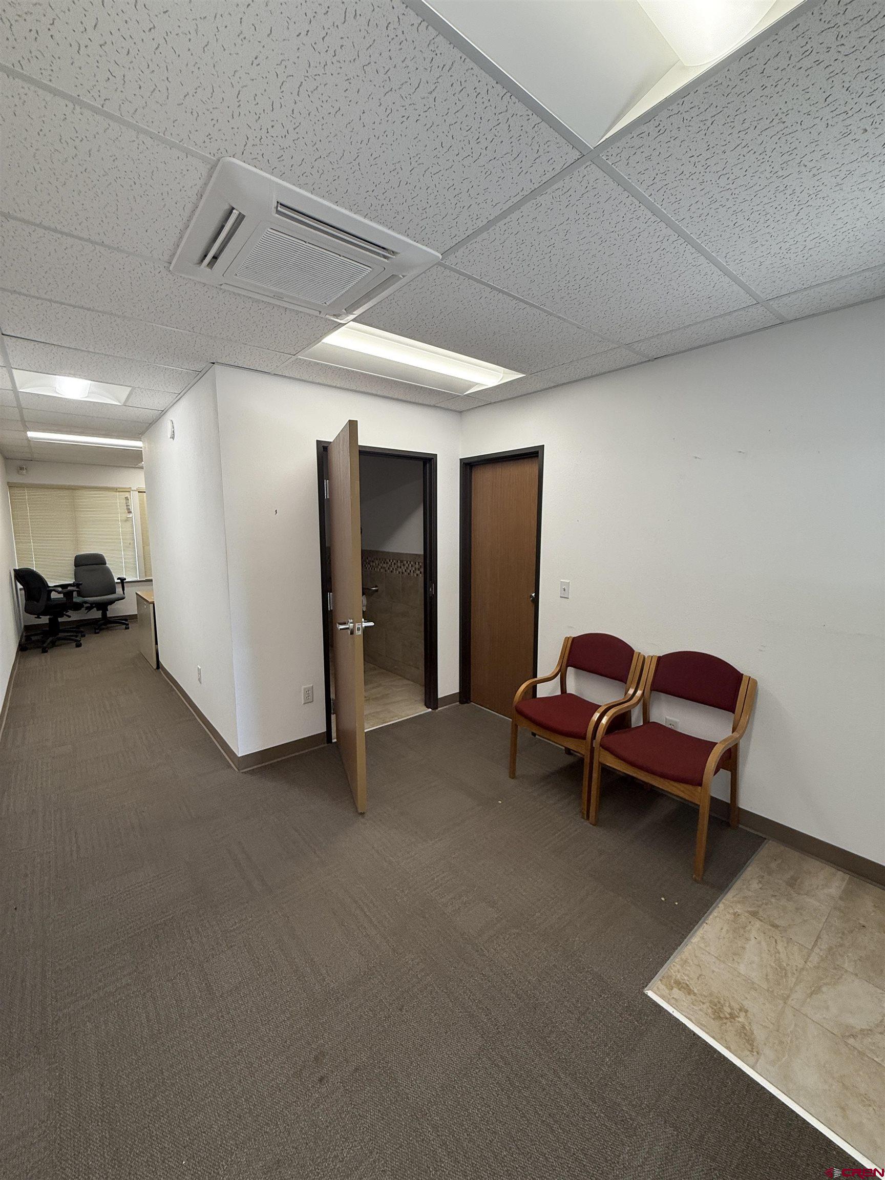 675 Industrial Boulevard, Unit 102 AND WAREHOUSE Delta, CO 81416 - Photo 4 of 24 a living room with furniture and a couch
