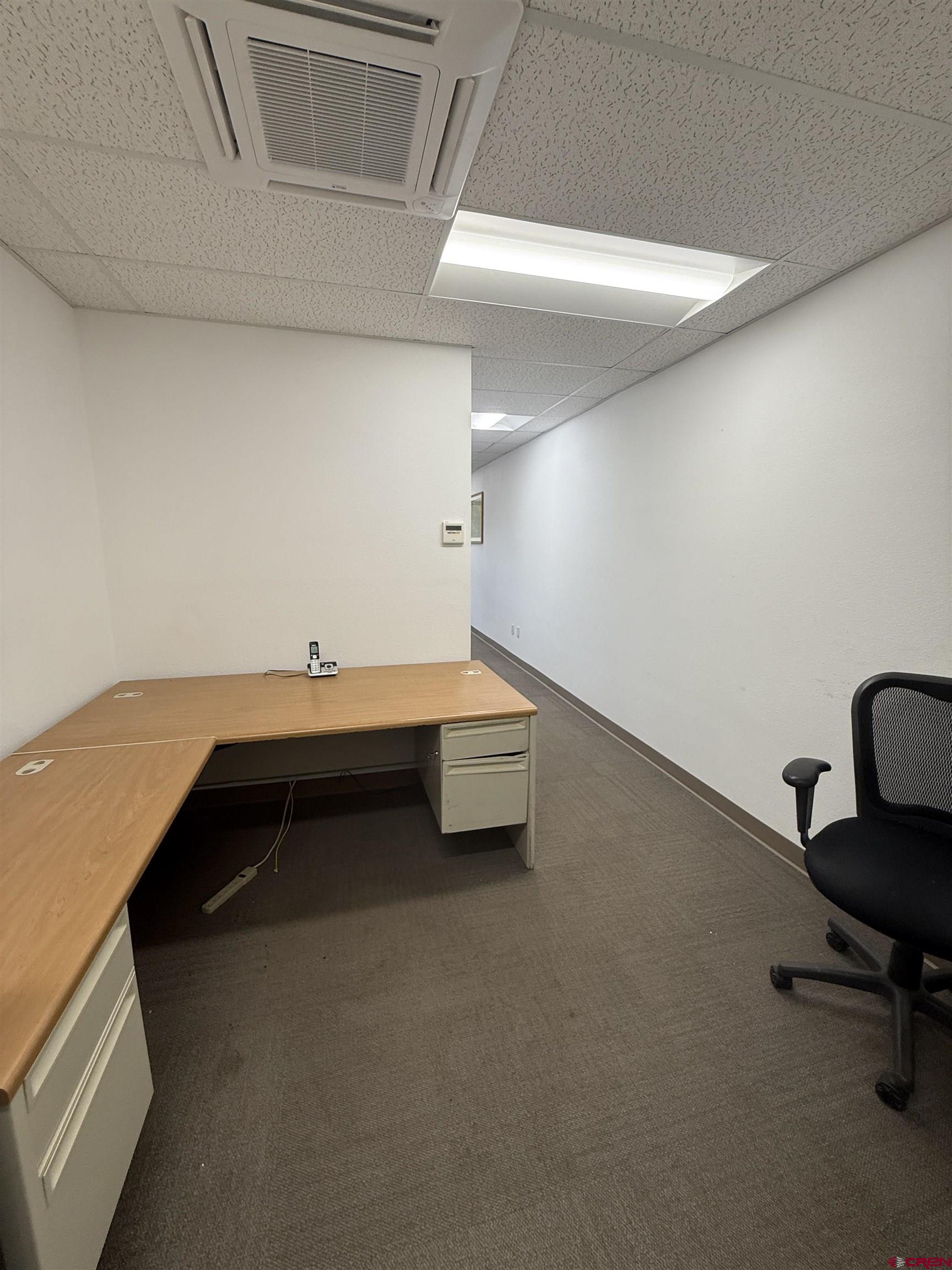 675 Industrial Boulevard, Unit 102 AND WAREHOUSE Delta, CO 81416 - Photo 5 of 24 a bedroom with a bed and a desk