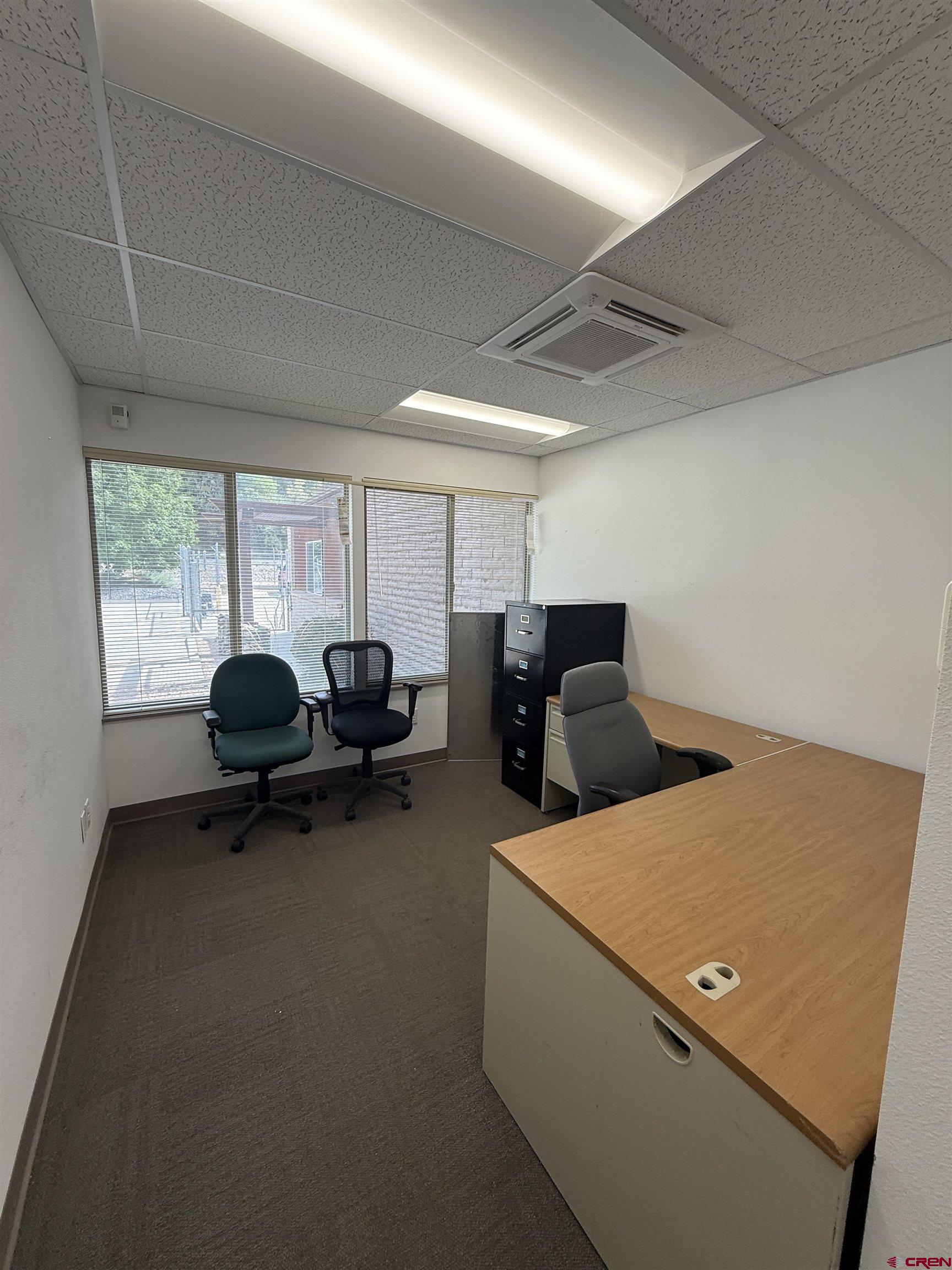 675 Industrial Boulevard, Unit 102 AND WAREHOUSE Delta, CO 81416 - Photo 6 of 24 a living room with furniture and a window