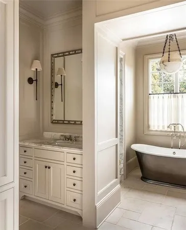 a bathroom with a granite countertop sink a shower and a mirror