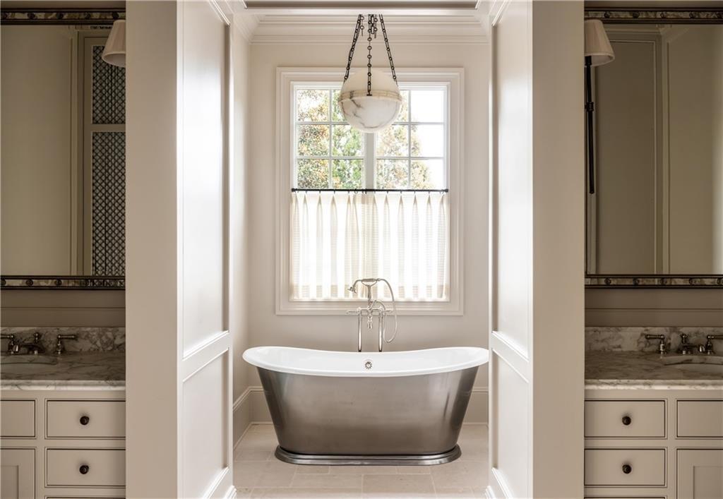 2681 Conns Creek Road Ball Ground, GA 30107 - Photo 15 of 26 a bath tub sitting in a bathroom next to a window