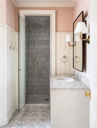 a view of a white building with a swimming pool and furniture