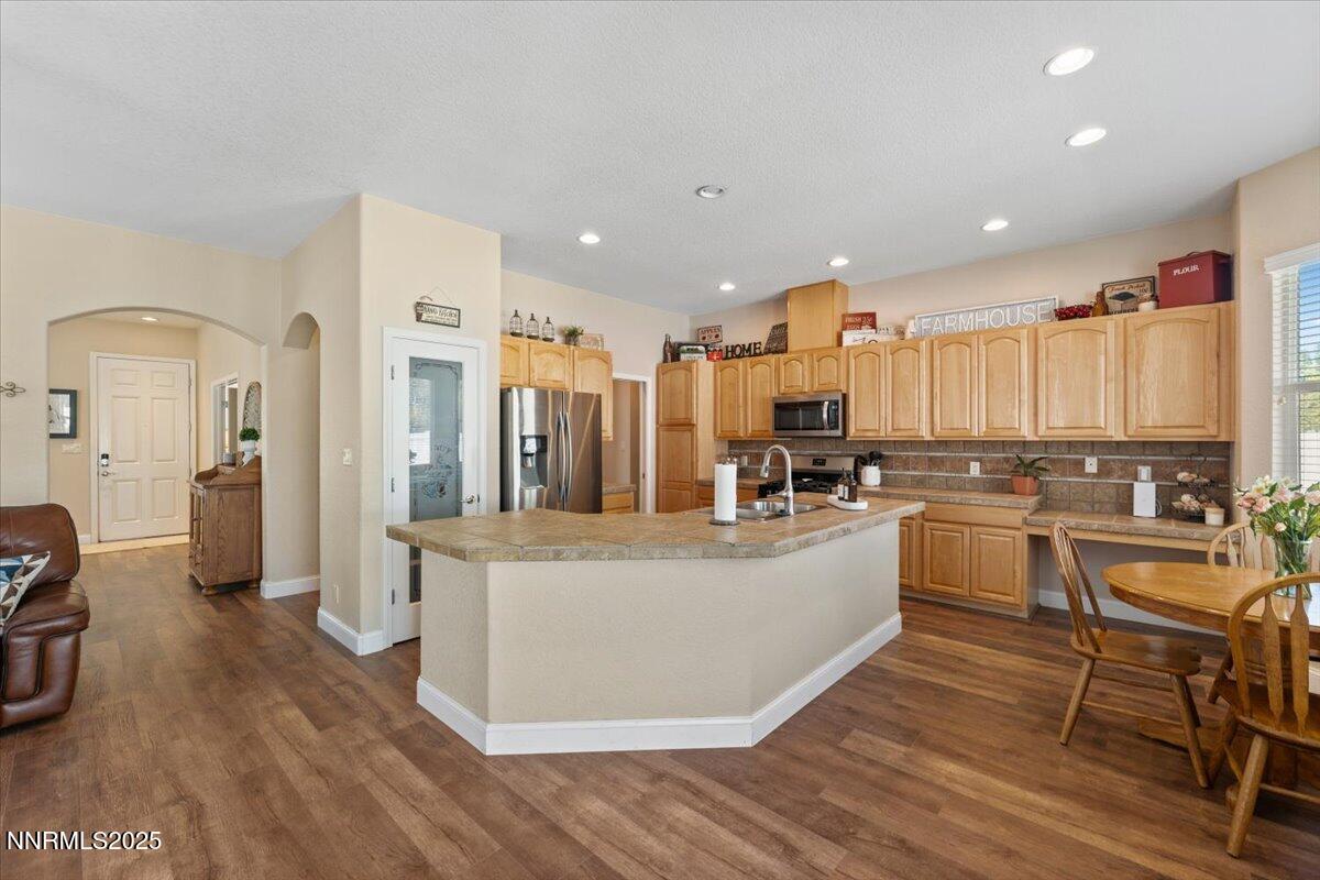 2415 Lincoln Meadows Drive Reno, NV 89521 - Photo 11 of 38 a large white kitchen with a large counter top appliances and cabinets