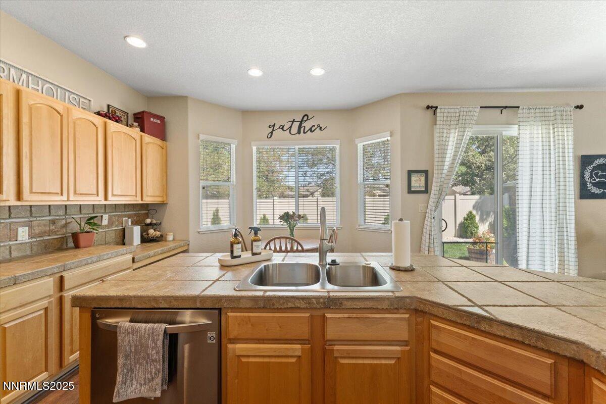 2415 Lincoln Meadows Drive Reno, NV 89521 - Photo 13 of 38 a kitchen with a sink and a window