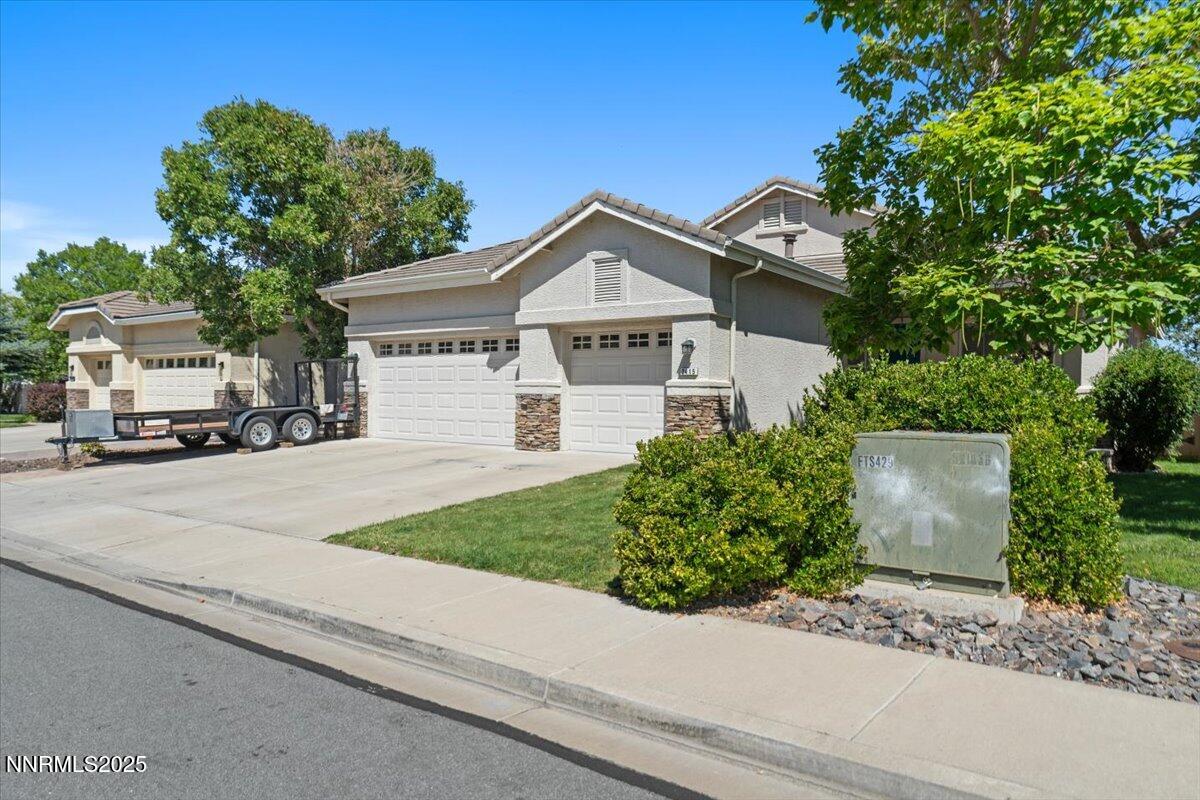 2415 Lincoln Meadows Drive Reno, NV 89521 - Photo 2 of 38 front view of a house with a yard