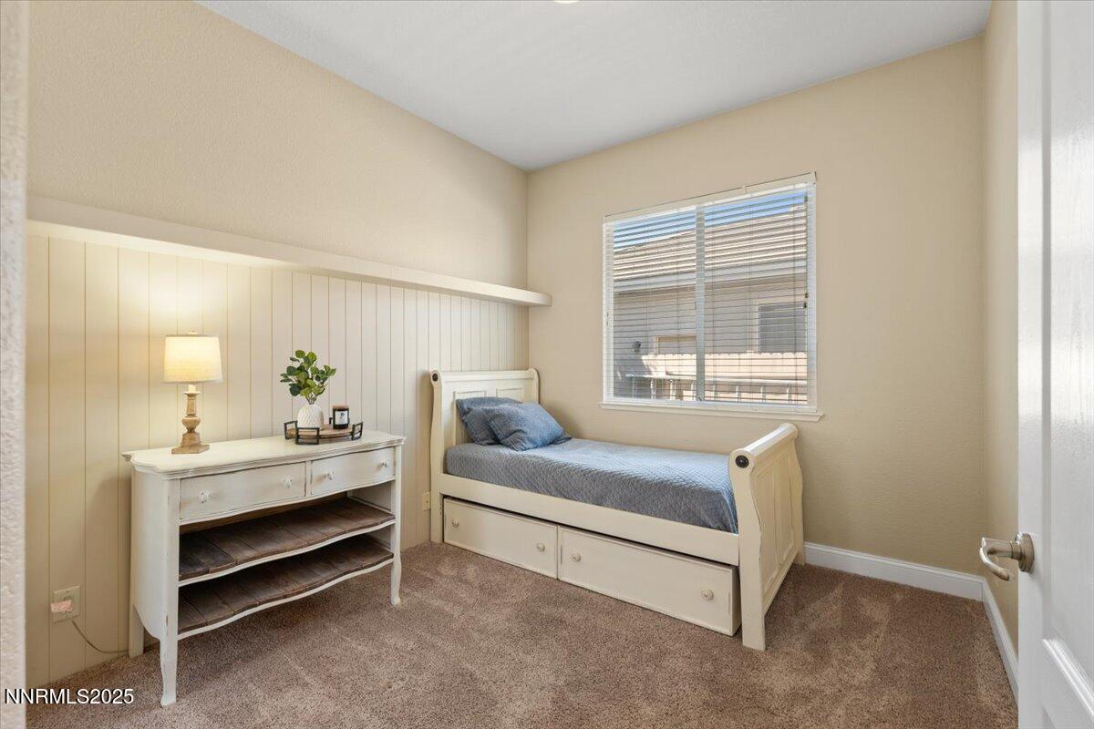 2415 Lincoln Meadows Drive Reno, NV 89521 - Photo 21 of 38 a bedroom with a bed and a window