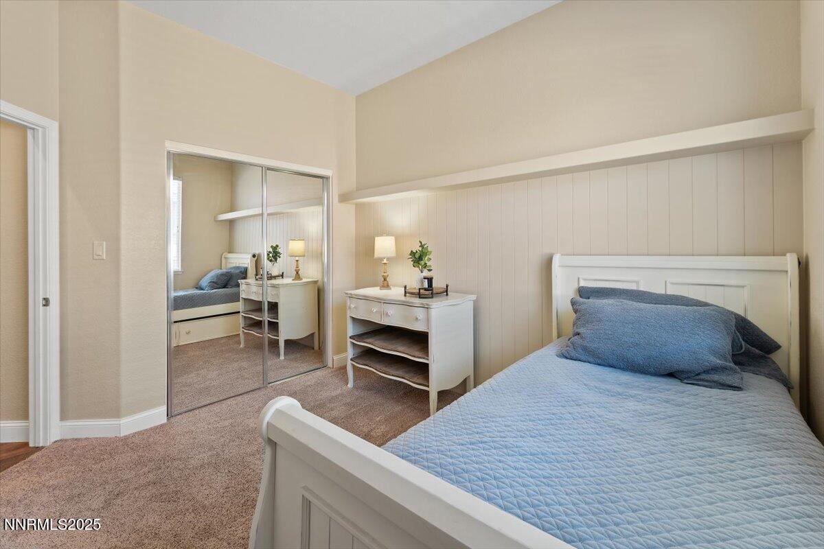 2415 Lincoln Meadows Drive Reno, NV 89521 - Photo 22 of 38 a bedroom with a bed and a view of kitchen