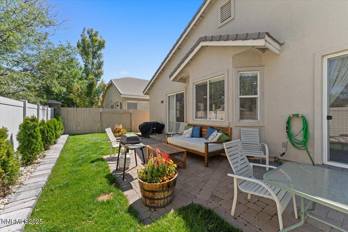 2415 Lincoln Meadows Drive Reno, NV 89521 - Photo 29 of 38 a view of a house with backyard sitting area and garden