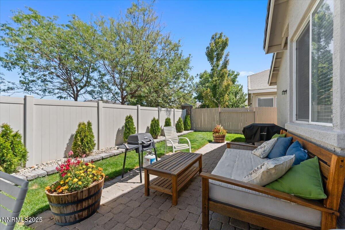 2415 Lincoln Meadows Drive Reno, NV 89521 - Photo 30 of 38 a view of a chairs and table in a backyard