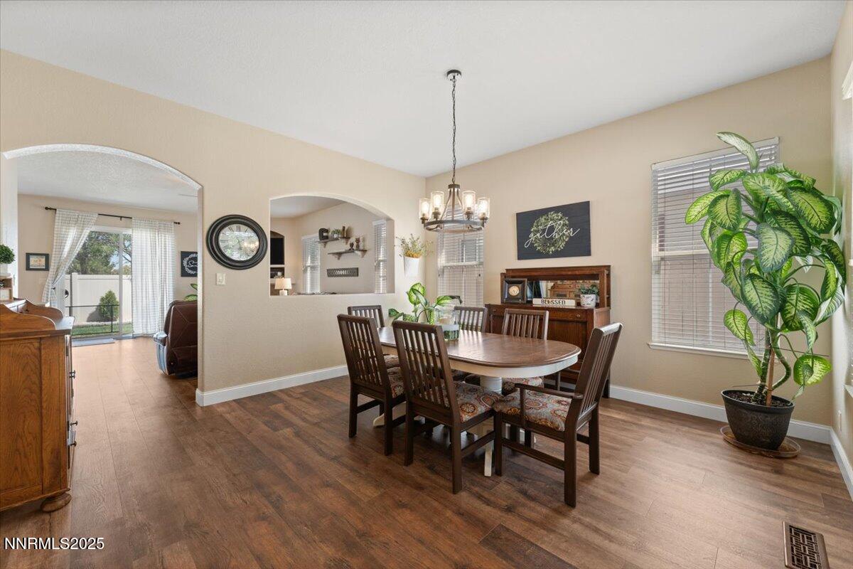 2415 Lincoln Meadows Drive Reno, NV 89521 - Photo 3 of 38 a view of a dining room with furniture window and wooden floor