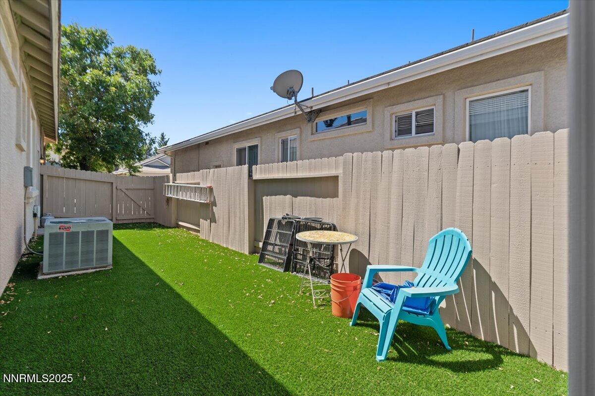 2415 Lincoln Meadows Drive Reno, NV 89521 - Photo 33 of 38 a view of backyard of house with furniture and a grill