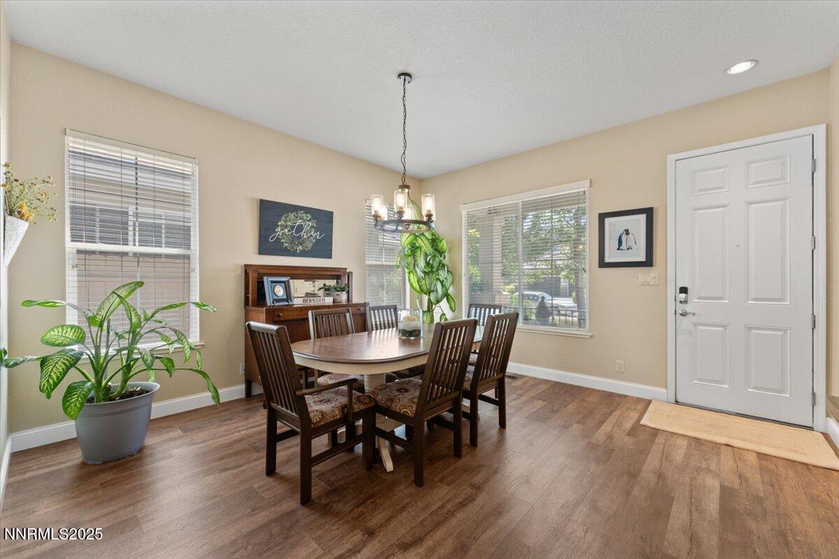 2415 Lincoln Meadows Drive Reno, NV 89521 - Photo 4 of 38 a view of a dining room with furniture window and wooden floor