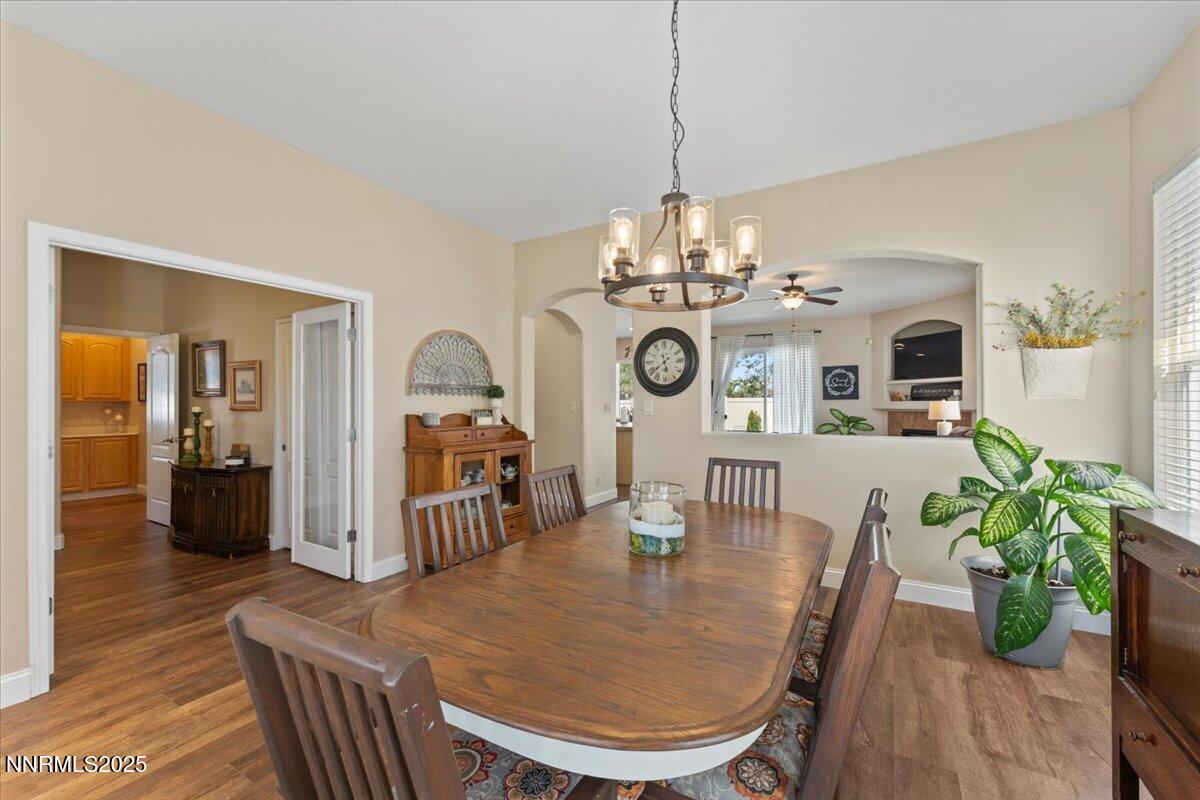 2415 Lincoln Meadows Drive Reno, NV 89521 - Photo 5 of 38 a view of a dining room with furniture wooden floor and chandelier
