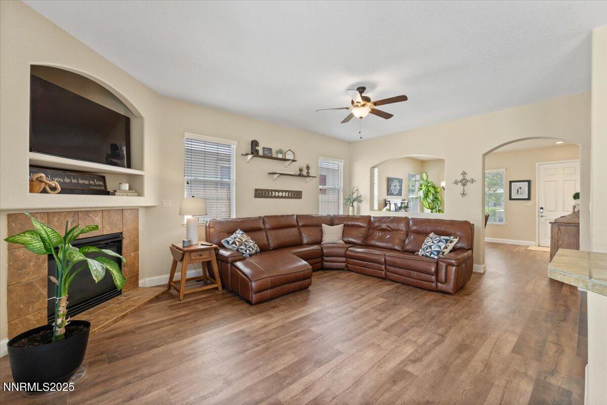2415 Lincoln Meadows Drive Reno, NV 89521 - Photo 8 of 38 a living room with furniture fireplace and flat screen tv