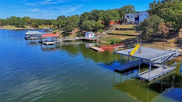 an aerial view of a house with pool swimming pool and outdoor seating