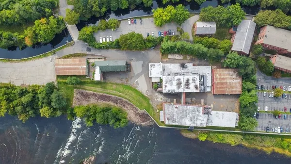 an aerial view of a house with outdoor space