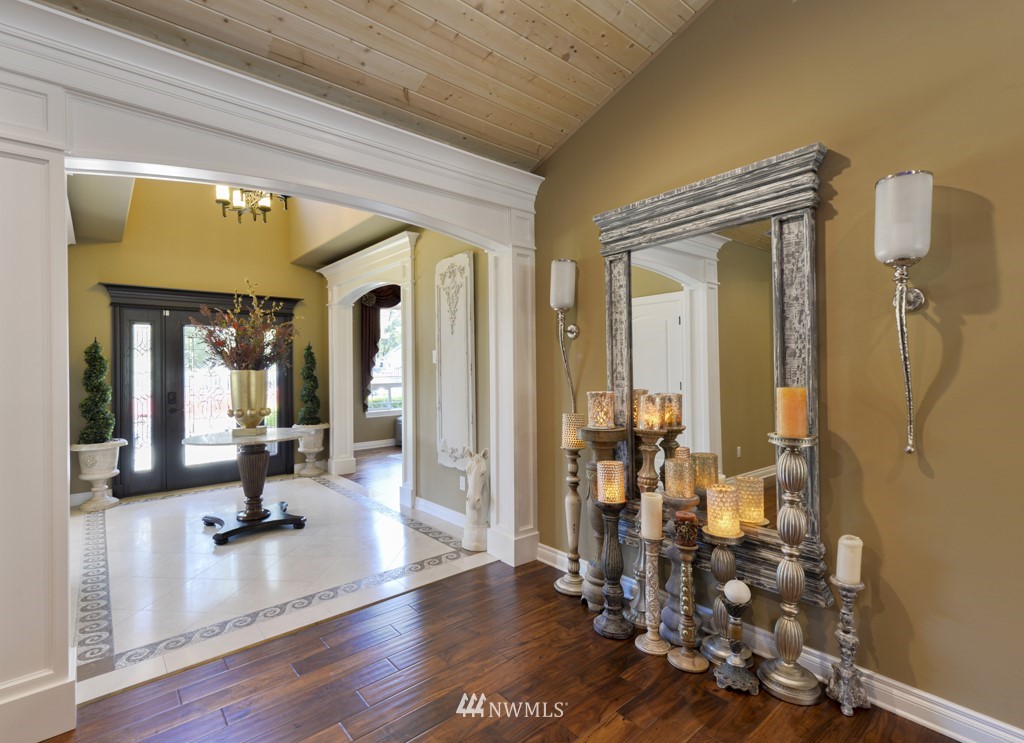 9908 Meadow Road Southwest Lakewood, WA 98499 - Photo 11 of 40 a view of a hallway with wooden floor and windows