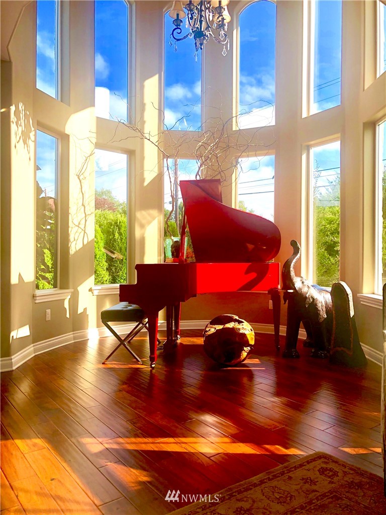 9908 Meadow Road Southwest Lakewood, WA 98499 - Photo 15 of 40 a bedroom with a bed and wooden floor