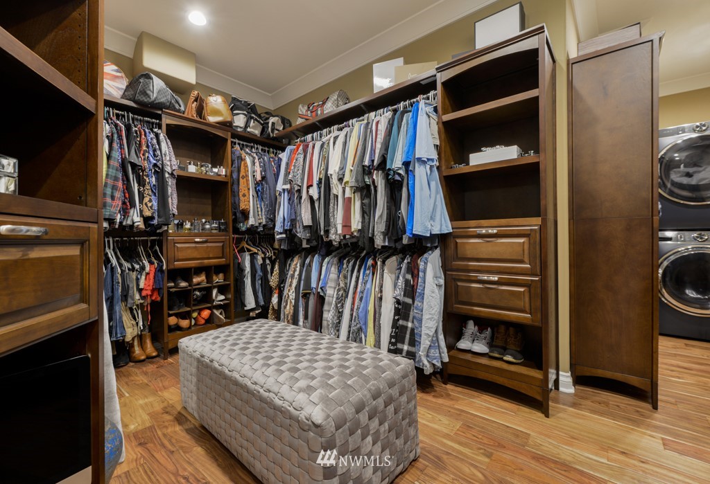 9908 Meadow Road Southwest Lakewood, WA 98499 - Photo 19 of 40 a bathroom with a granite countertop shower a mirror and bathtub