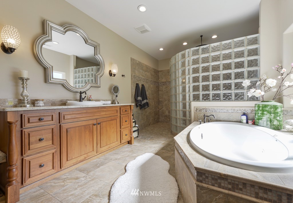 9908 Meadow Road Southwest Lakewood, WA 98499 - Photo 21 of 40 a kitchen with stainless steel appliances a sink and a stove