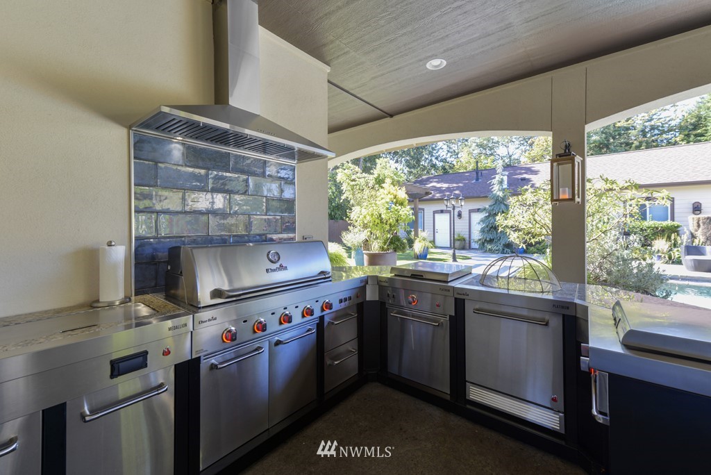 9908 Meadow Road Southwest Lakewood, WA 98499 - Photo 24 of 40 a living room with furniture and a fireplace