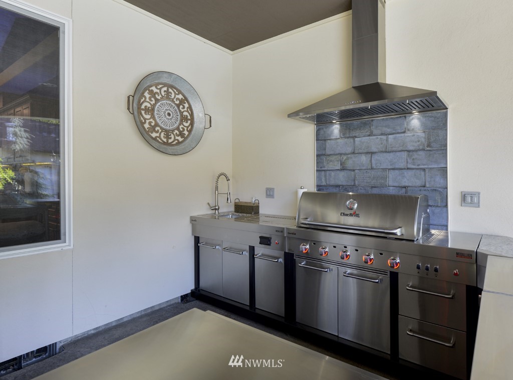 9908 Meadow Road Southwest Lakewood, WA 98499 - Photo 25 of 40 a view of a house with swimming pool and a yard