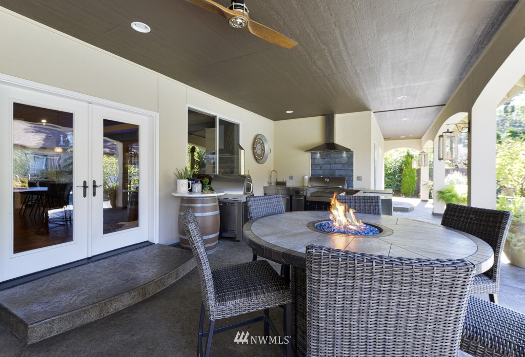9908 Meadow Road Southwest Lakewood, WA 98499 - Photo 26 of 40 a spacious bedroom with a bed and a flat screen tv