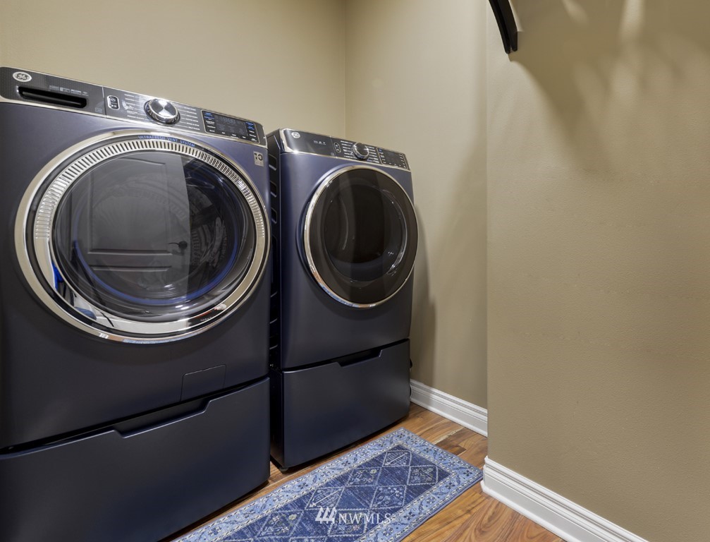 9908 Meadow Road Southwest Lakewood, WA 98499 - Photo 29 of 40 a living room with furniture and a flat screen tv