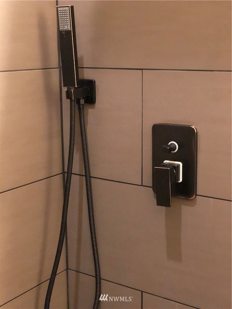 9908 Meadow Road Southwest Lakewood, WA 98499 - Photo 32 of 40 a bathroom with a sink toilet and shower