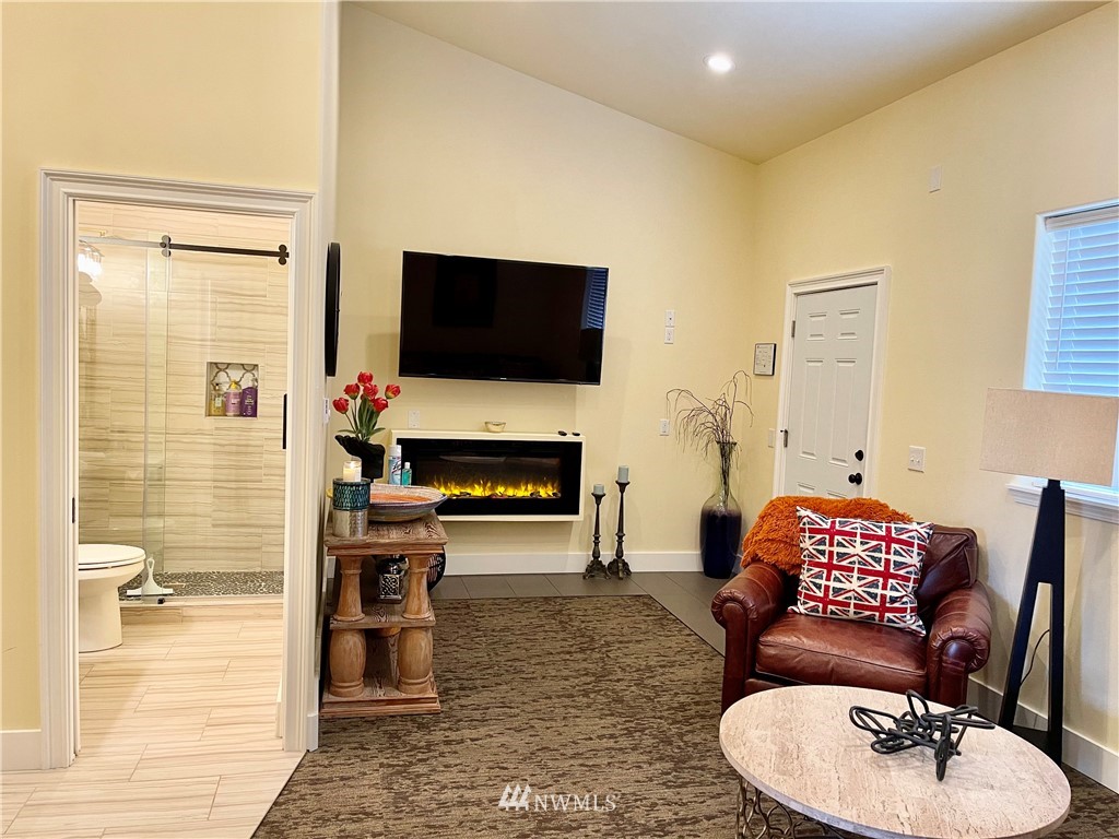 9908 Meadow Road Southwest Lakewood, WA 98499 - Photo 37 of 40 a living room with furniture and a flat screen tv
