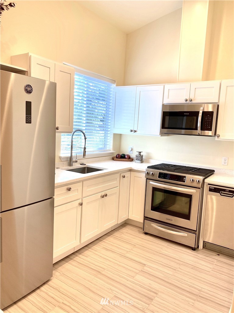 9908 Meadow Road Southwest Lakewood, WA 98499 - Photo 38 of 40 a close view of washer and dryer