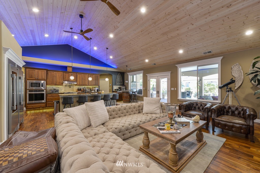9908 Meadow Road Southwest Lakewood, WA 98499 - Photo 6 of 40 a kitchen with stainless steel appliances granite countertop a sink a stove and cabinets
