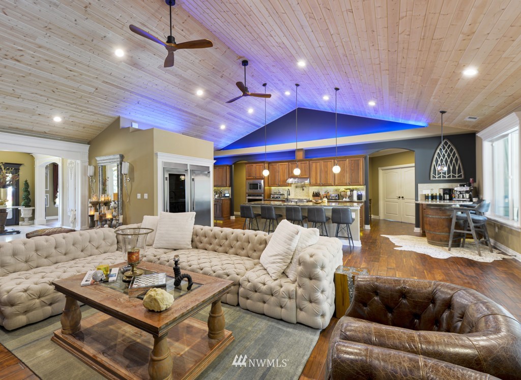 9908 Meadow Road Southwest Lakewood, WA 98499 - Photo 7 of 40 a view of a hallway with wooden floor and windows
