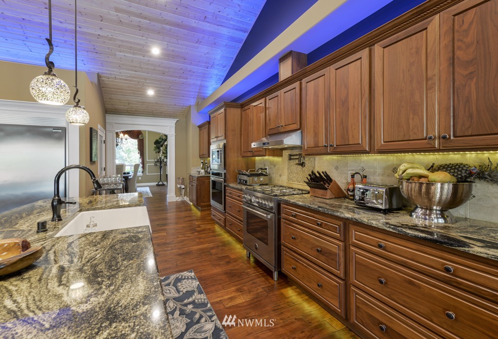 9908 Meadow Road Southwest Lakewood, WA 98499 - Photo 9 of 40 a view of a dining room with furniture window and wooden floor