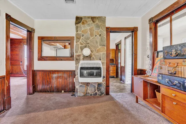 a kitchen with stainless steel appliances a stove a refrigerator and a cabinets