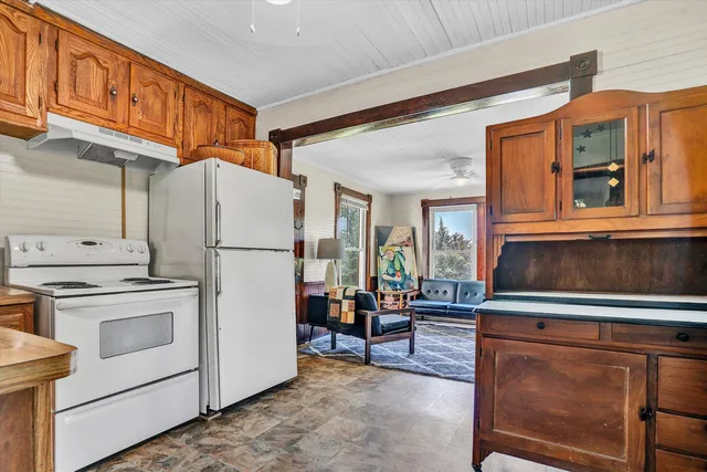 a kitchen with stainless steel appliances a refrigerator and a stove